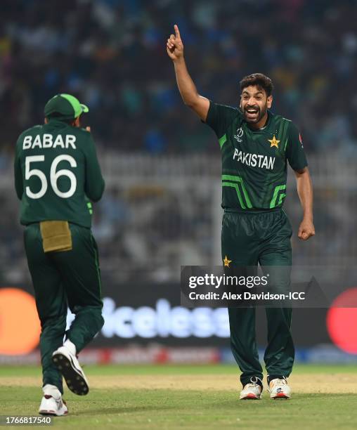 Haris Rauf of Pakistan celebrates the wicket of Shakib Al Hasan of Bangladesh with team mate Babar Azam during the ICC Men's Cricket World Cup India...