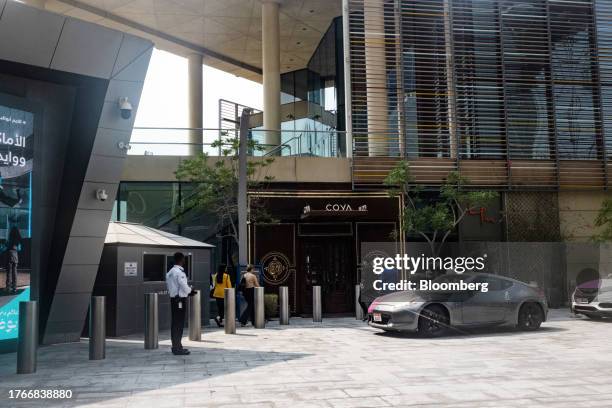 Valets serve customers arriving at Coya restaurant in the Abu Dhabi International Financial Center in Abu Dhabi, United Arab Emirates, on Friday,...