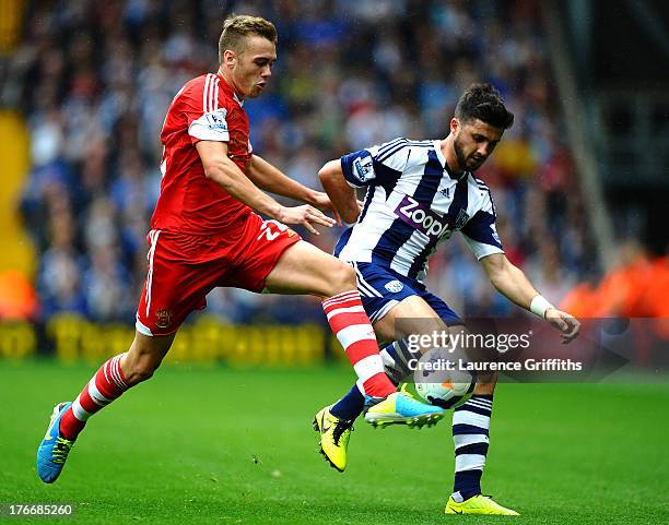 Callum Chambers of Southampton battles with Shane Long of West Bromwich Albion during the Barclays Premier League match between West Bromwich Albion...