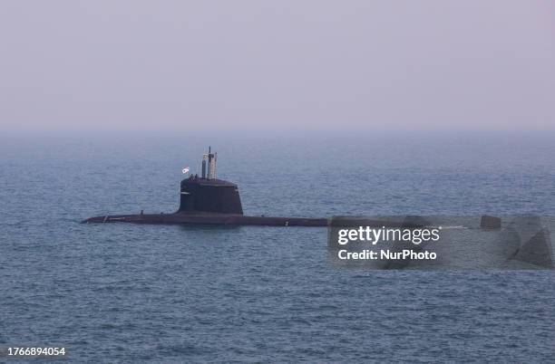 Submarine INS Kalvari is seen passing by from warship INS Beas during a media day at sea event in Mumbai, India, 03 November, 2023.