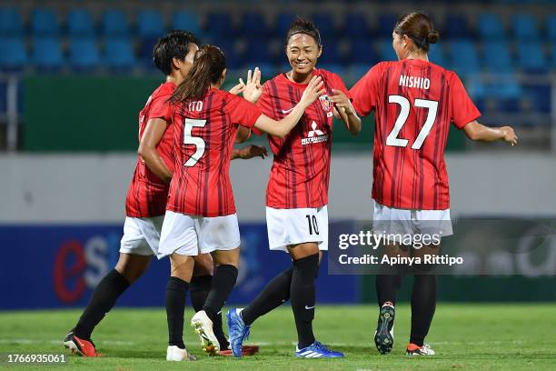 Kozue Ando of Mitsubishi Heavy Industries Urawa Reds Ladies celebrates scoring her side's eighth goal with her teammate during the AFC Women's Club...