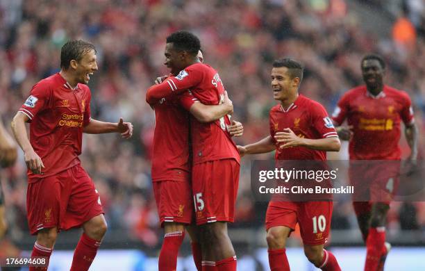 Daniel Sturridge of Liverpool is congratulated by Iago Aspas,Lucas,Philuppe Coutinho and Kolo Toure after scoring the first goal during the Barclays...