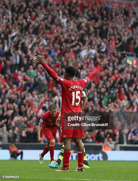 Daniel Sturridge of Liverpool celebrates after scoring the first goal during the Barclays Premier League match between Liverpool and Stoke City at...