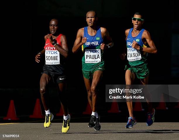 Peter Kimeli Some of Kenya, Paulo Roberto Paula of Brazil, Solonei da Silva of Brazil compete in the Men's Marathon during Day Eight of the 14th IAAF...