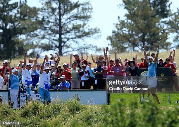 Anna Nordqvist of Sweden and the European Team celebrate her hole in one on the 17th hole as her partner Caroline Hedwall of Sweden and caddies...
