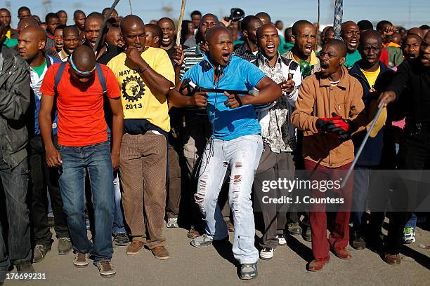 Miners and supporters of the Marikana mining community march near the Lonmin Platinum Mine to commiserate the one year anniversary of the massacre at...