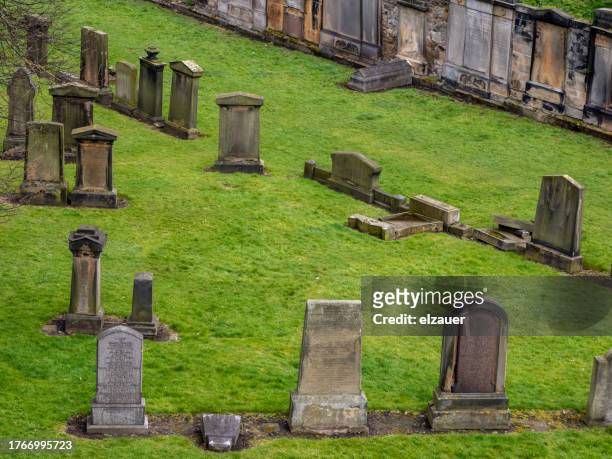 tombstones in cemetery of parish church of st cuthbert , edinburgh - file graveyard fields 3.jpg stock pictures, royalty-free photos & images
