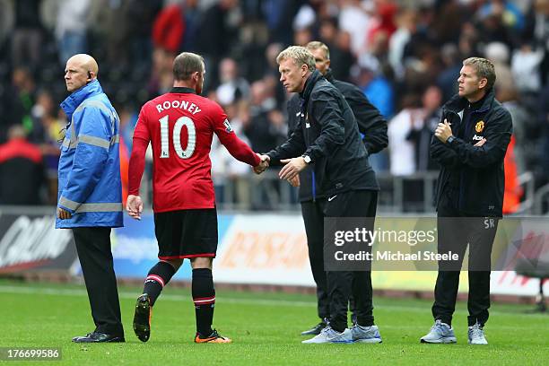 David Moyes the manager of Manchester United shakes hands with Wayne Rooney after the final whistle during the Barclays Premier League match between...