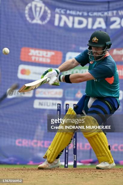 Australia's Glenn Maxwell bats in the nets during a practice session on the eve of their 2023 ICC Men's Cricket World Cup one-day international match...