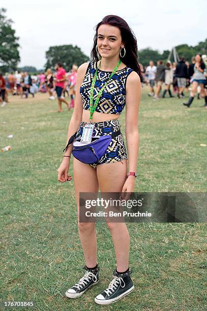 Anna poses wearing a 2 piece from Boohoo.com with Converse All Stars during V Festival at Hylands Park on August 17, 2013 in Chelmsford, England.