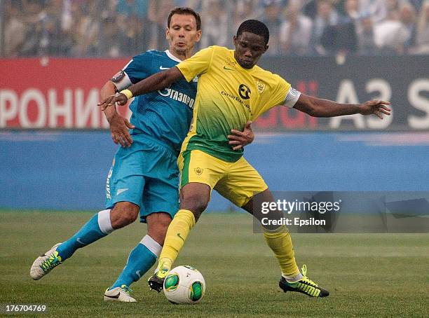 Konstantin Zyryanov of FC Zenit St. Petersburg and Samuel Eto'o of FC Anji Makhachkala vie for the ball during the Russian Premier League match...