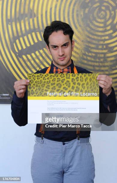 Reza Gamini poses with the menzione special award during the 66th Locarno Film Festival on August 17, 2013 in Locarno, Switzerland.