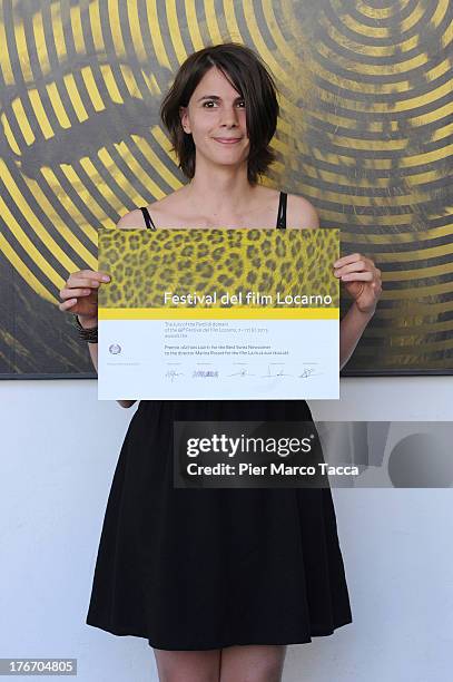 Marina Rosset poses with the Action Light award during the 66th Locarno Film Festival on August 17, 2013 in Locarno, Switzerland.