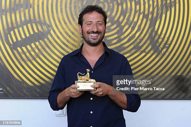 Alessandro Falco poses with the Pardino d'oro award during the 66th Locarno Film Festival on August 17, 2013 in Locarno, Switzerland.
