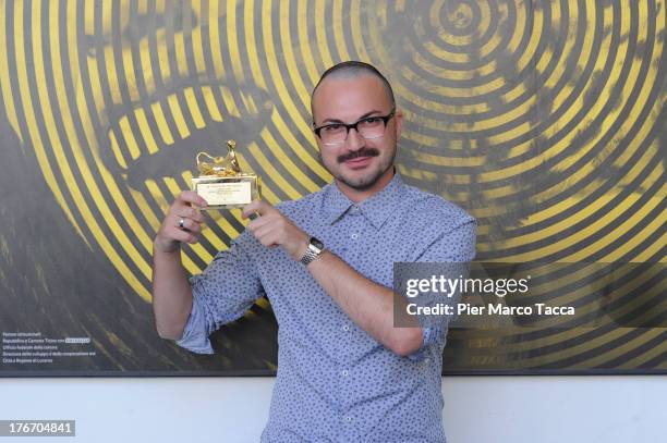 Michele Pennetta poses with the Pardino d'oro award during the 66th Locarno Film Festival on August 17, 2013 in Locarno, Switzerland.