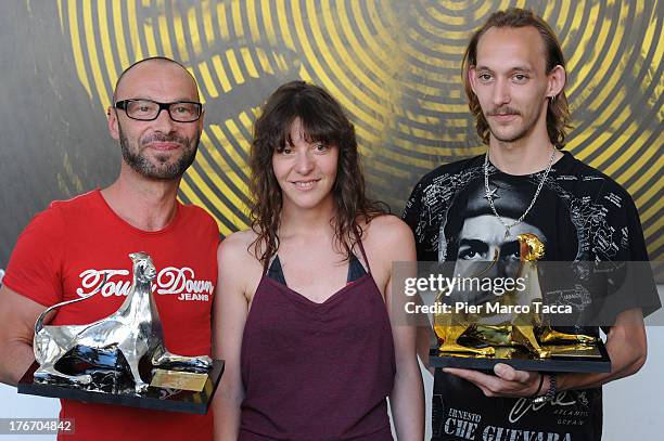 Gilles Deroo, Marianne Pistone and Michael Mormentyn pose with the the Best First Feature award during the 66th Locarno Film Festival on August 17,...