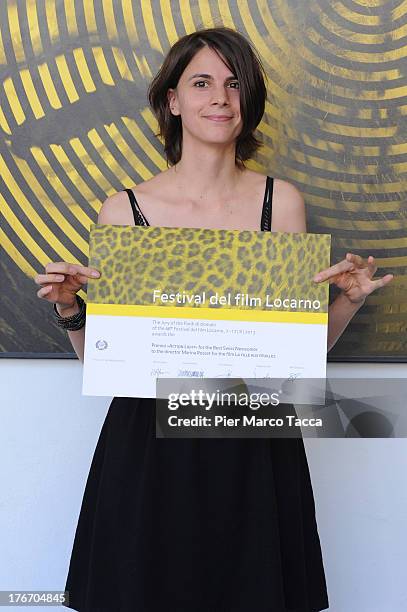 Marina Rosset poses with the Action Light award during the 66th Locarno Film Festival on August 17, 2013 in Locarno, Switzerland.