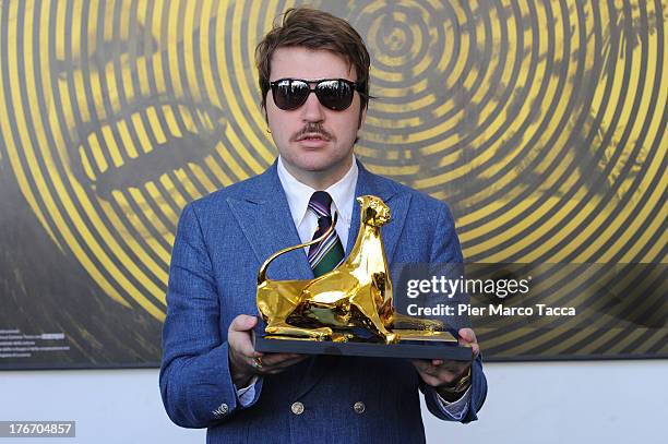 Albert Serra poses with the Pardo d'oro during the 66th Locarno Film Festival on August 17, 2013 in Locarno, Switzerland.