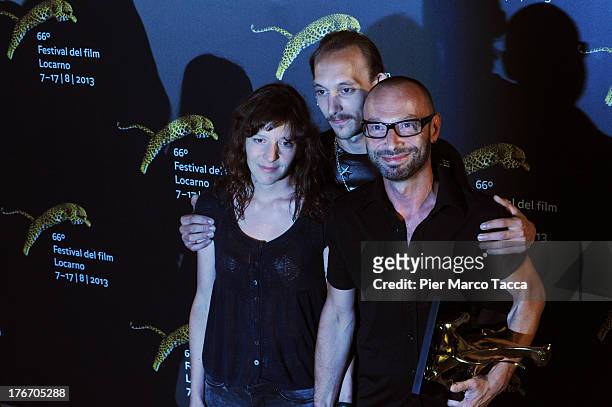 Gilles Deroo, Marianne Pistone and Michael Mormentyn pose with the the Best First Feature award during the 66th Locarno Film Festival on August 17,...