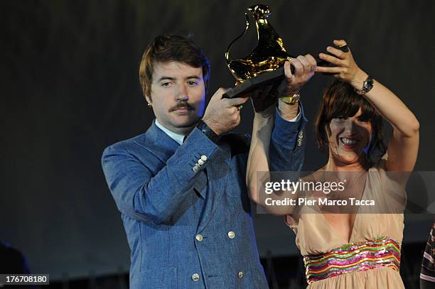 Albert Serra and Montse Triola pose with the Pardo d'oro during the 66th Locarno Film Festival on August 17, 2013 in Locarno, Switzerland.