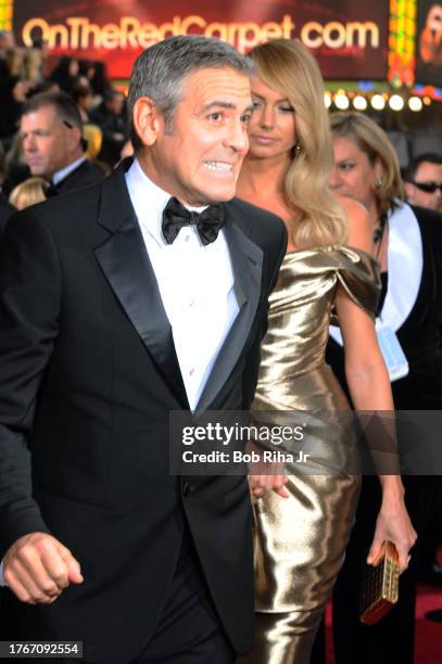 Actor George Clooney and actress, model, and former professional wrestler Stacey Keibler arrive for the 84th annual Academy Awards Show, February 26,...