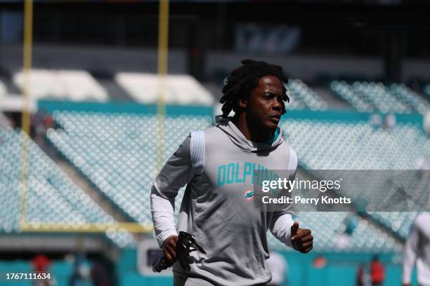 Teddy Bridgewater of the Miami Dolphins runs on the field prior to a game between against the New England Patriots at Hard Rock Stadium on September...
