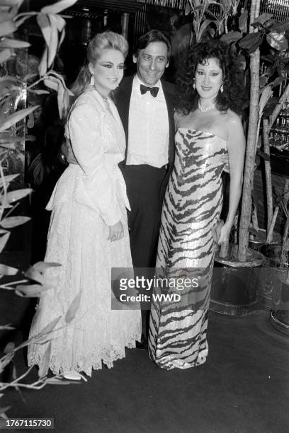 Cornelia Guest, Lewis Feder, and Francesca Braschi attend a party at Regine's, a nightclub in New York City, on November 28, 1984.
