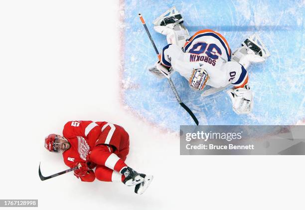 David Perron of the Detroit Red Wings is struck with a puck during the game against the New York Islanders at UBS Arena on October 30, 2023 in...