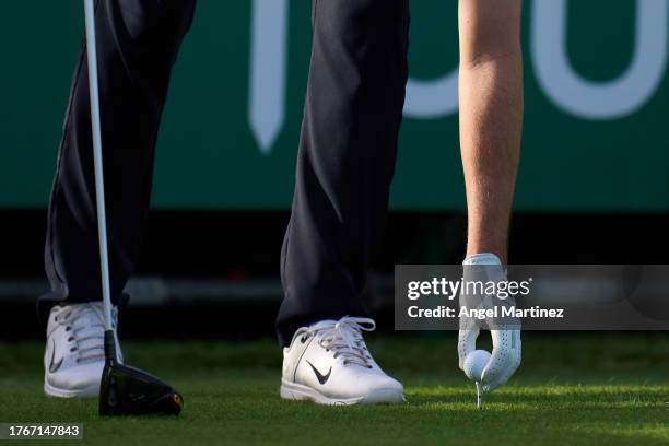 Ashley Chesters of England places a ball on the tee during the Pro-Am prior to the Rolex Challenge Tour Grand Final supported by the R&A 2023 at Club...