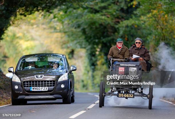 Participants seen driving a steam powered 1901 Locomobile during the annual London to Brighton Veteran Car Run on November 5, 2023 in Staplefield,...