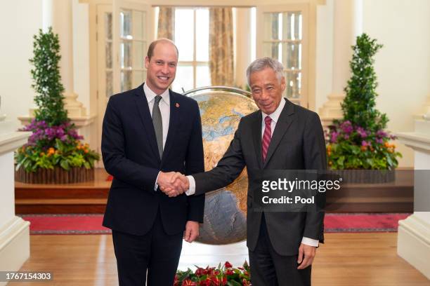 Prince William, Prince of Wales shakes hands with the Prime Minister of Singapore, Lee Hsien Loong, during an audience at the Istana in Singapore,...