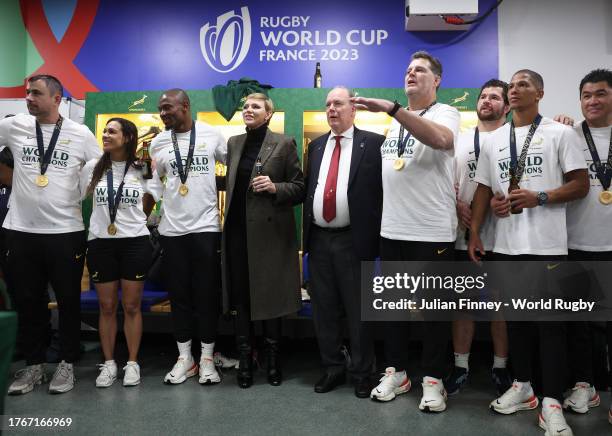 Albert II, Prince of Monaco and Charlene, Princess of Monaco meet players in the dressing room following their win in the Rugby World Cup France 2023...