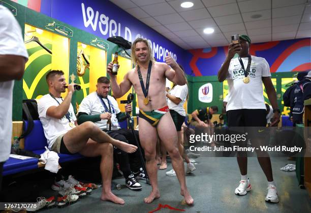 Faf de Klerk of South Africa celebrates victory inside the dressing room following the Rugby World Cup Final match between New Zealand and South...