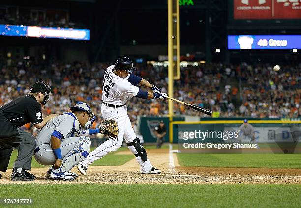 Miguel Cabrera of the Detroit Tigers hits a ninth inning walk off home run in front of Salvador Perez of the Kansas City Royals to beat the Royals...