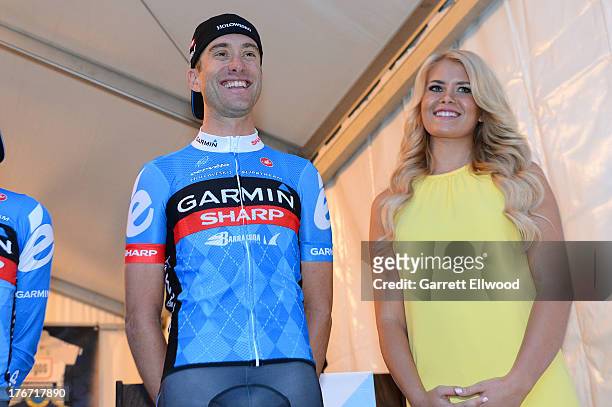 Christian Vande Velde of the United States riding for Team Garmin Sharp stands on stage during the team presentation ceremony prior to the start of...