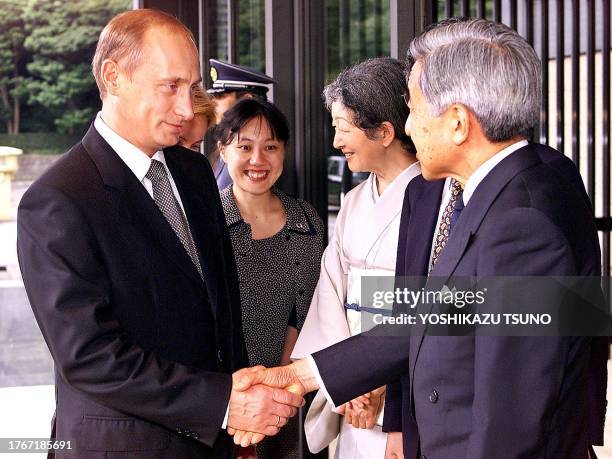 Russian President Vladimir Putin says goodbye to Japanese Emperor Akihito as he leaves the Imperial Palace after their luncheon 04 September 2000,...