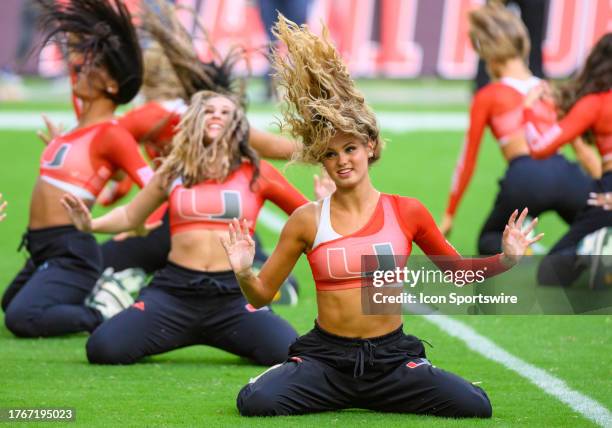 Miami Sunsations dance team preforms on the field during the college football game between the Virginia Cavaliers and the University of Miami...