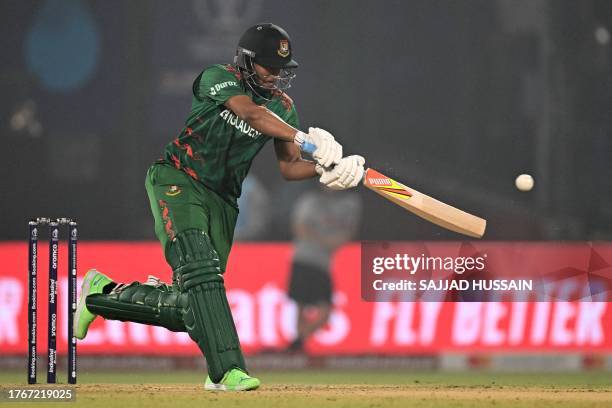 Bangladesh's captain Shakib Al Hasan plays a shot during the 2023 ICC Men's Cricket World Cup one-day international match between Bangladesh and Sri...