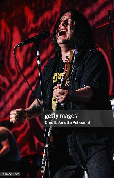 Robby Takac of the Goo Goo Dolls performs at Nikon at Jones Beach Theater on August 17, 2013 in Wantagh, New York.