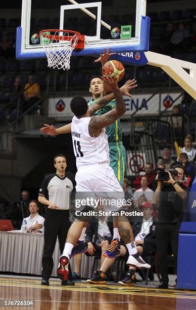 Ben Simmons of the Boomers denies BJ Anthony a shot during the Men's FIBA Oceania Championship match between the Australian Boomers and the New...