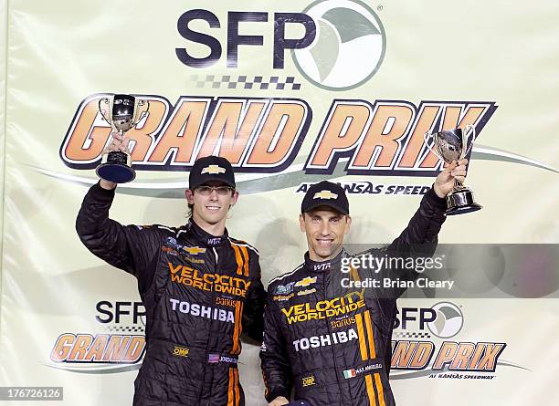 Jordan Taylor and Max Angelelli celebrate after winning the SFP Grand Prix at Kansas Speedway on August 17, 2013 in Kansas City, Kansas.