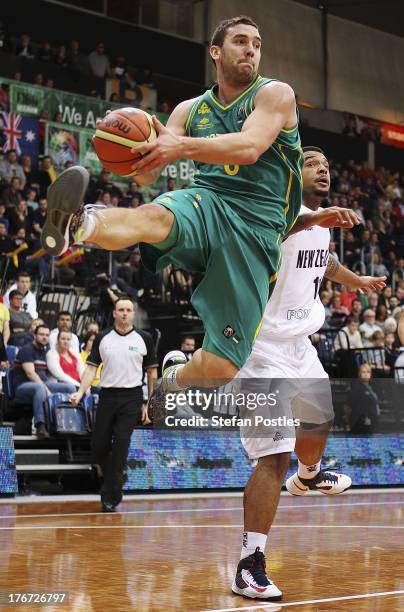 Adam Gibson of the Boomers drives to the basket during the Men's FIBA Oceania Championship match between the Australian Boomers and the New Zealand...