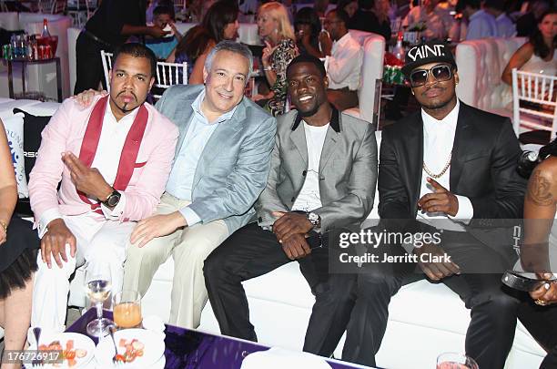 Johnny Nunez, Stuart Snyder, Kevin Hart and Ne-Yo attend the 2nd annual Compound Foundation Fostering A Legacy Benefit on August 17, 2013 in East...