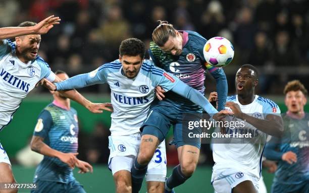 Marcin Kaminski of FC Shalke 04 scores their side's first goal during the DFB cup second round match between FC St. Pauli and FC Schalke 04 at...