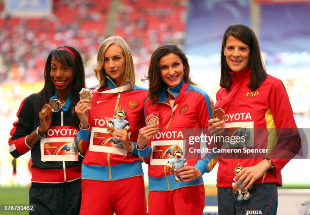 Silver medalist Brigetta Barrett of the United States, Gold medalist Svetlana Shkolina of Russia and joint bronze medalists Anna Chicherova of Russia...