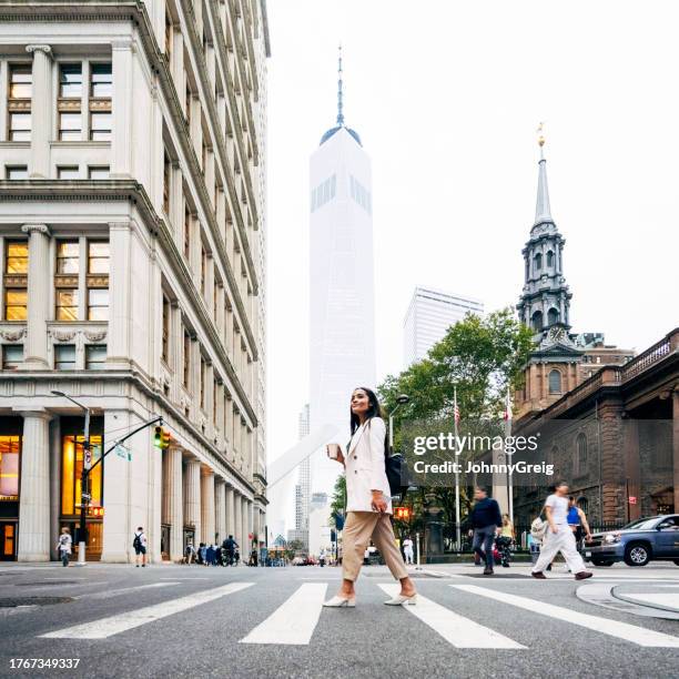 black businesswoman in zebra crossing at broadway and fulton - walk new york stock pictures, royalty-free photos & images
