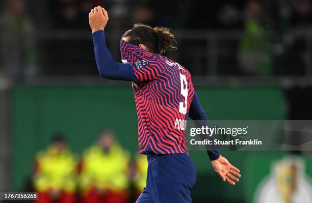 Yussuf Poulsen of RB Leipzig reacts after being shown a red card during the DFB cup second round match between VfL Wolfsburg and RB Leipzig at...