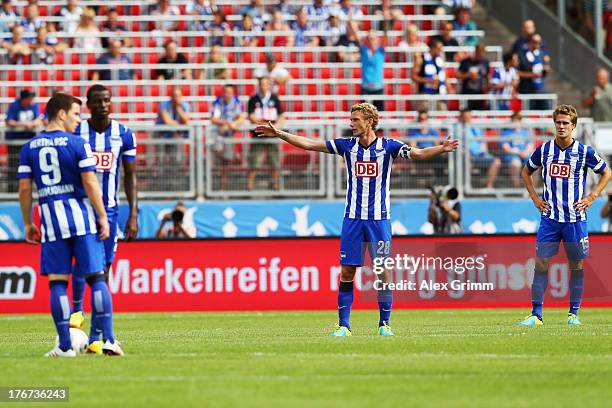 Alexander Baumjohann, Adrian Ramos, Fabian Lustenberger and Sebastian Langkamp react after Josip Drmic of Nuernberg scored his team's first goal...