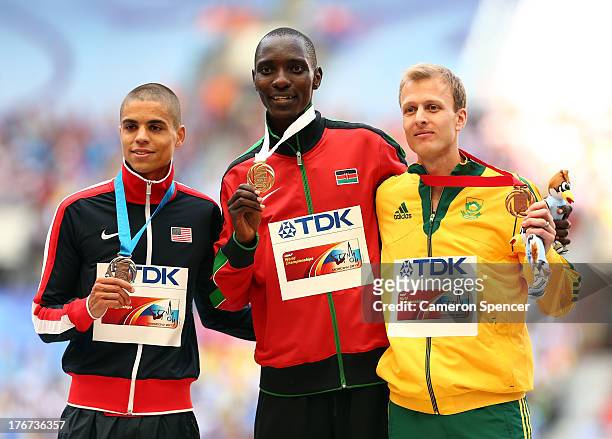 Silver medalist Matthew Centrowitz of the United States, gold medalist Asbel Kiprop of Kenya and bronze medalist Johan Cronje of South Africa stand...