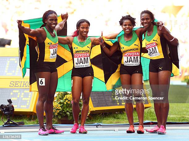 Gold medalists Carrie Russell, Shelly-Ann Fraser-Pryce, Schillonie Calvert and Nickiesha Wilson of Jamaica pose after the Women's 4x100 metres final...